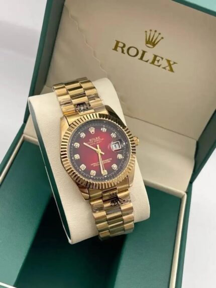 Rolex Day-Date 40mm gold watch with red diamond-set dial
